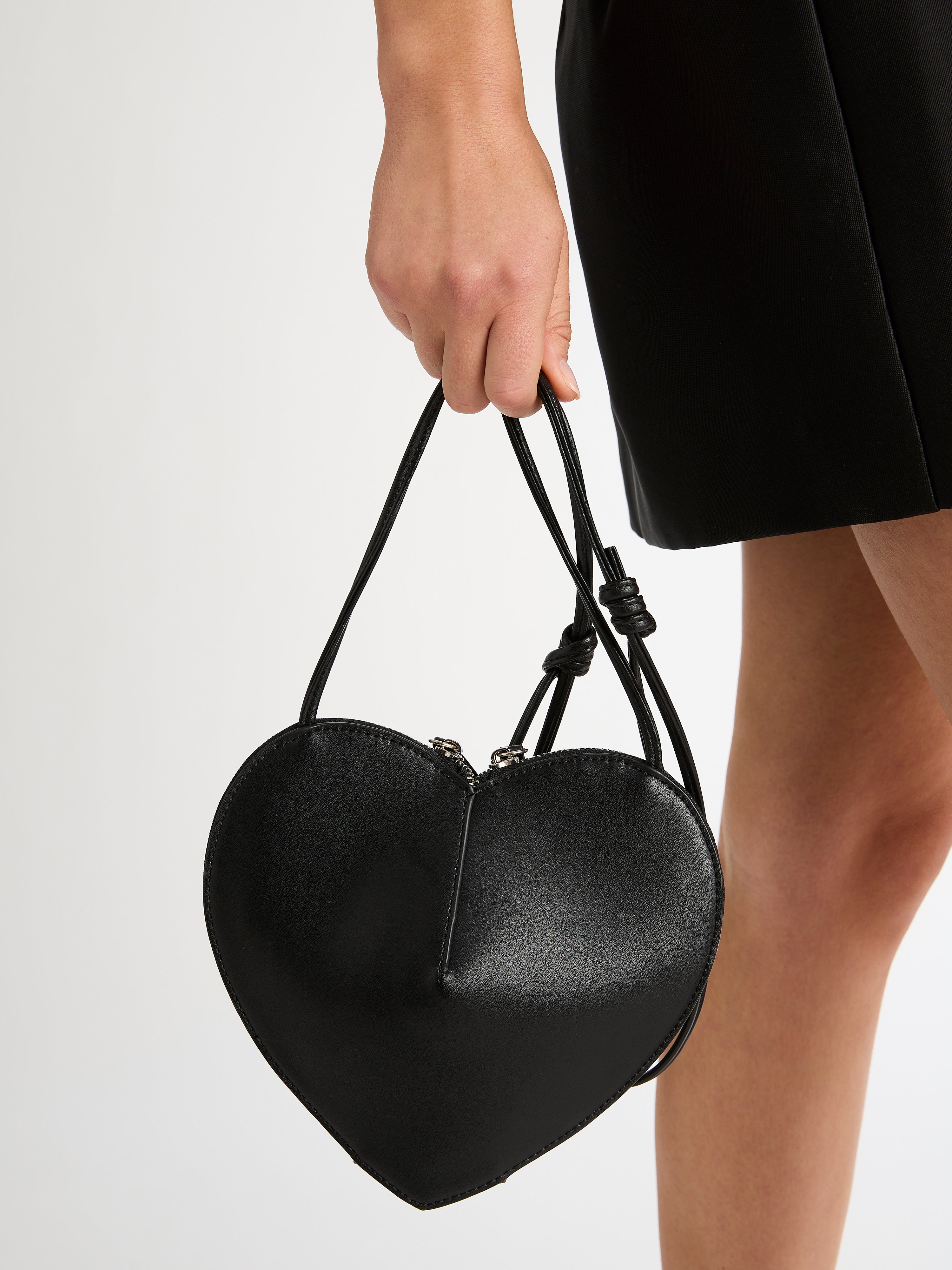 Black heart shaped online bag