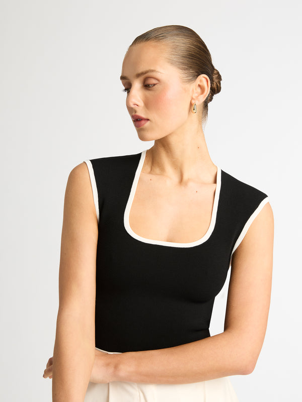 SENSATION TOP IN BLACK WITH WHITE BINDS DETAIL IMAGE